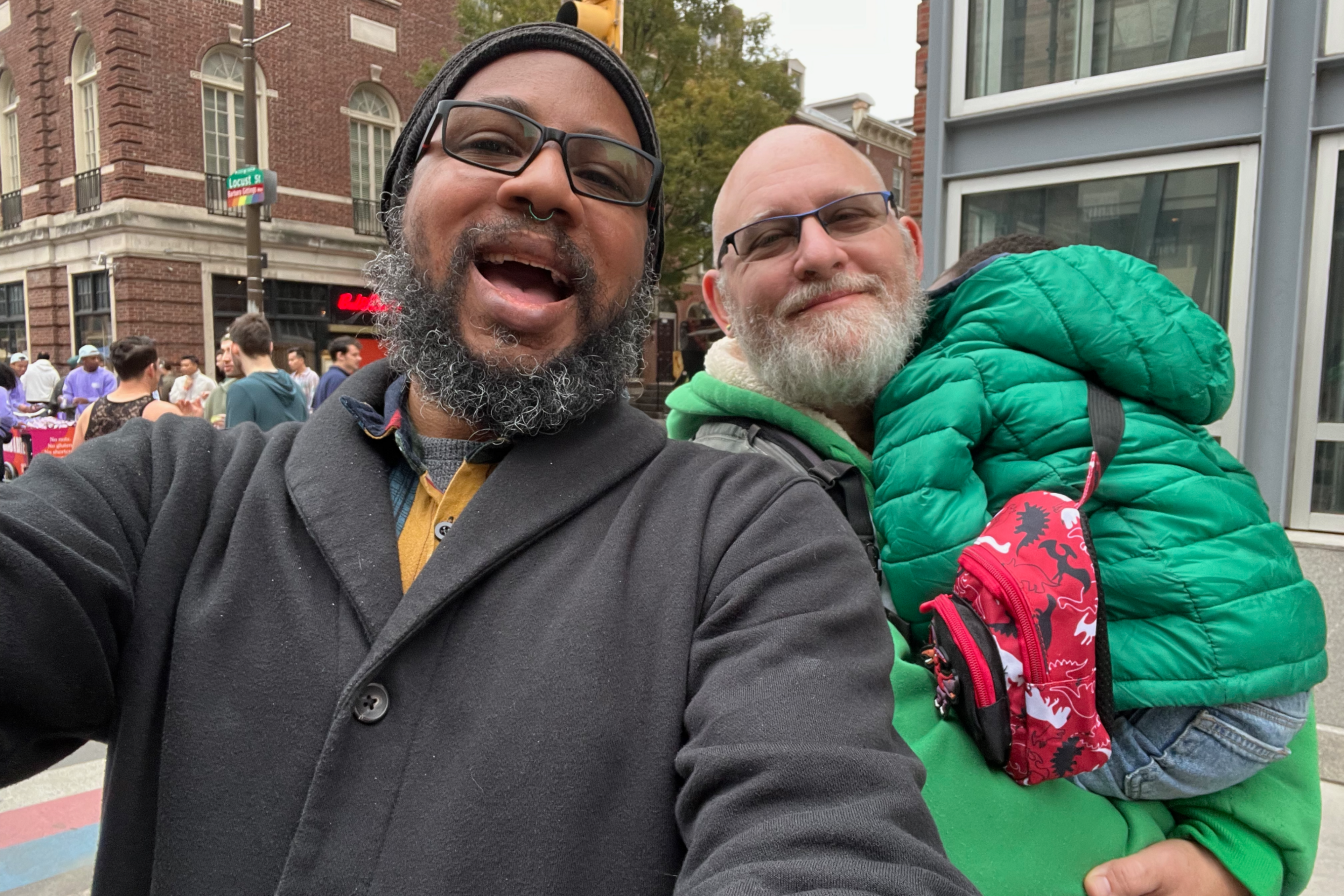 Phish and Tim (holding their sleeping child) at a street festival in Philadelphia, PA